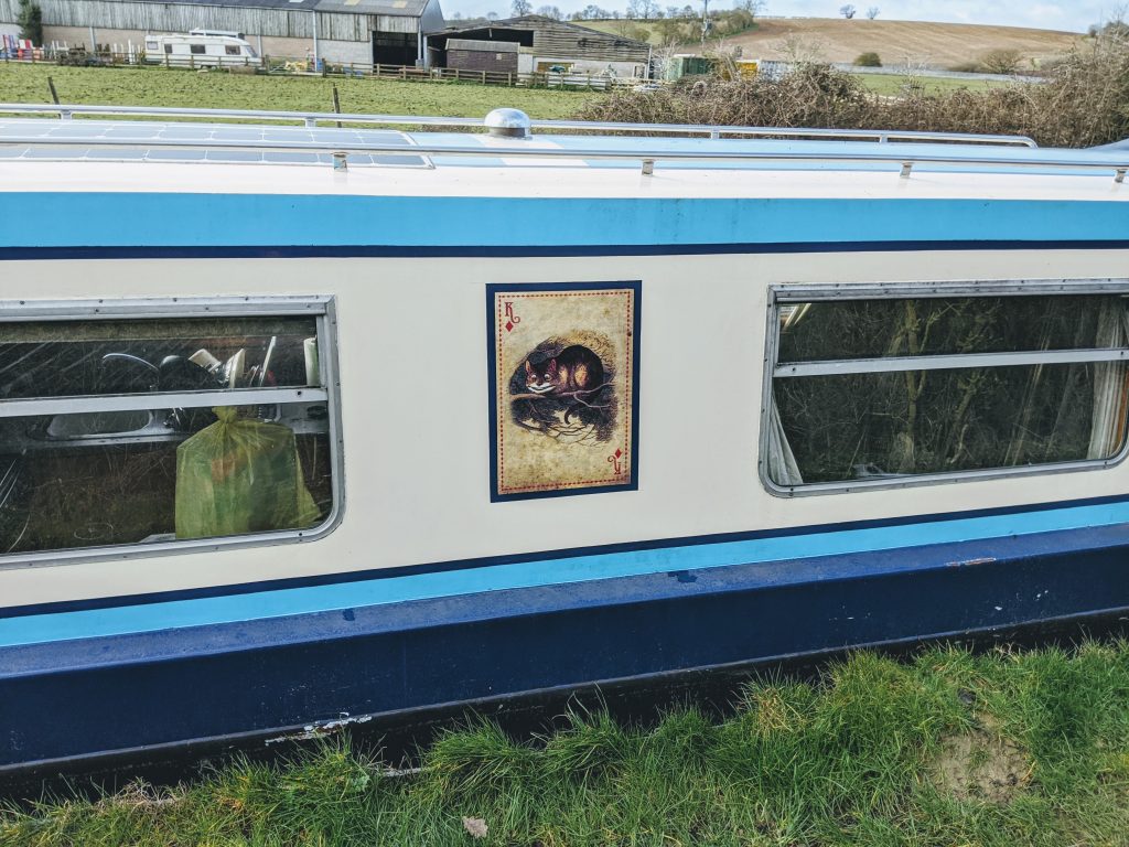 Painting a narrowboat.