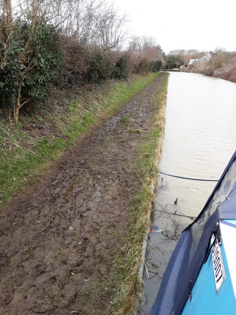 A muddy towpath near Banbury. Spiceball park nature reserve on the Oxford canal.
