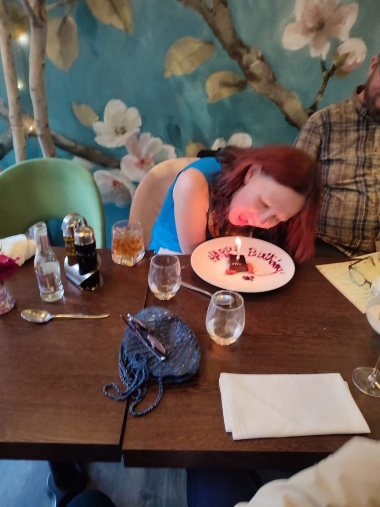 Kerri blows out birthday cake